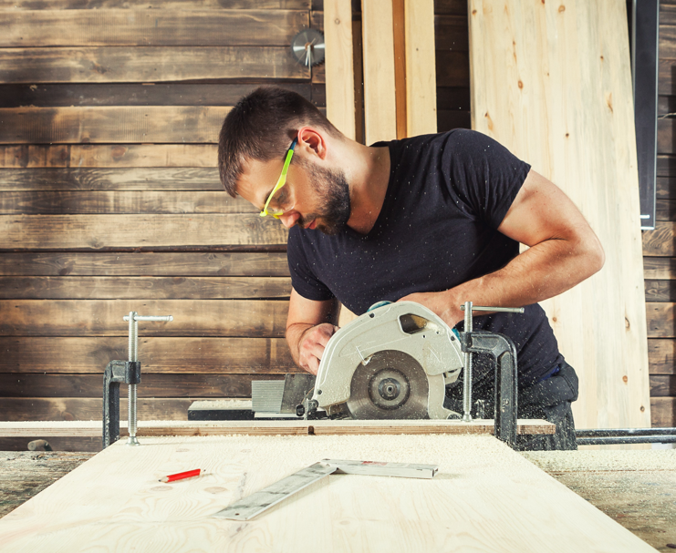 Tradesman at work using equipment