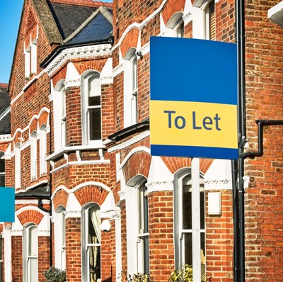 Row of Victorian terrace housing with "To Let" sign  Row of Victorian terrace housing with "To Let" sign